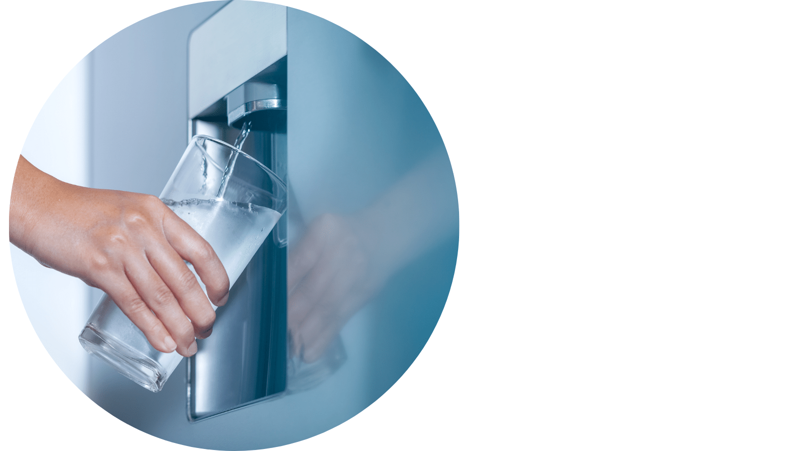 A person filling up a glass from a cold water dispenser